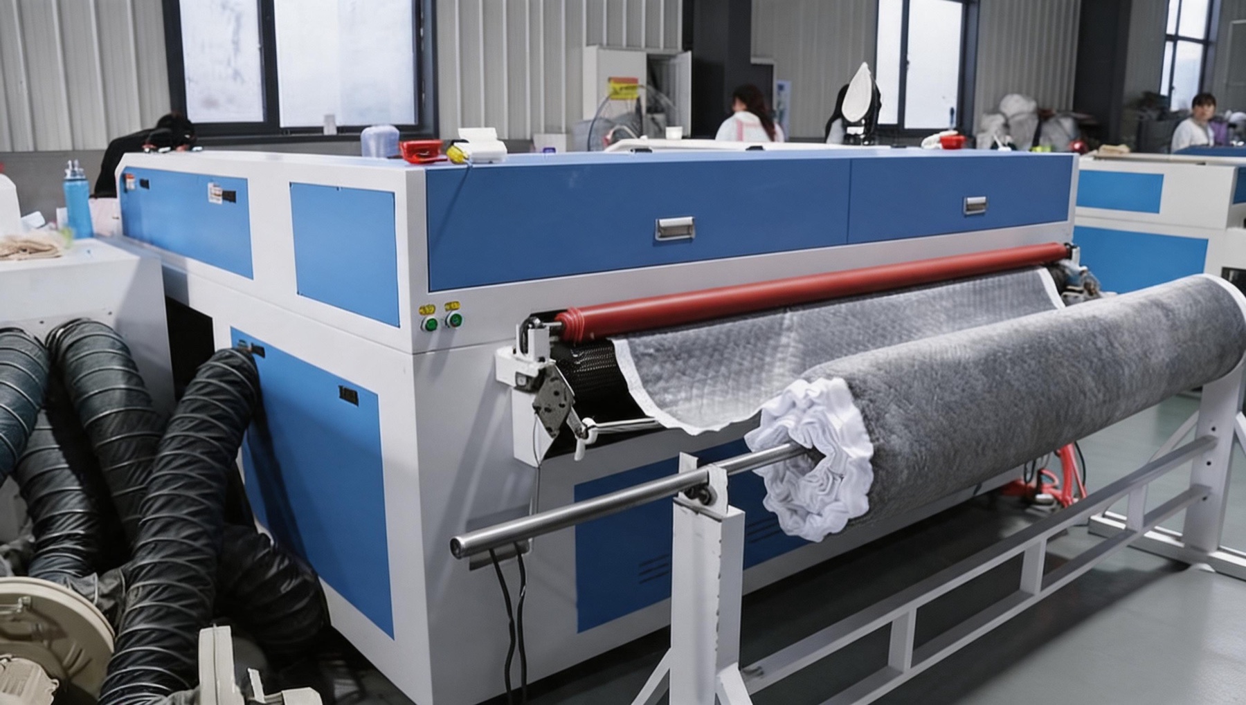 Fabric cutting equipment at the Cozynest manufacturing facility